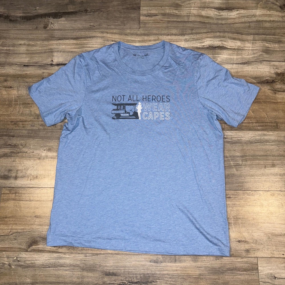 TravisMathew Not All Heroes Wear Capes Golf Cart Graphic T-Shirt Mens Large Blue